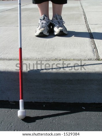 Blind woman traveling with white cane