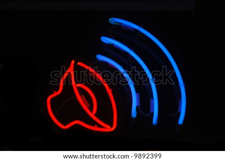 Neon sign with a speaker playing music