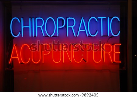 Neon sign advertising chiropractic and acupuncture services