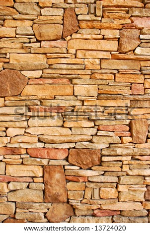 Flat rocks layered to form a solid wall