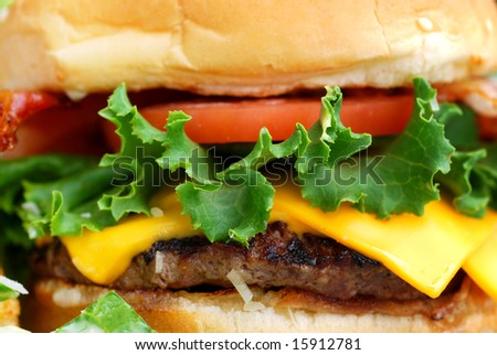 Bacon cheeseburger with lettuce and tomato