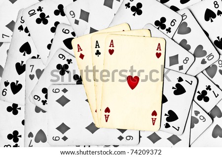 three color aces on a black and white cards background