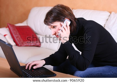 Young lady with a computer problem calling support (can also be used as working from home) - home environment