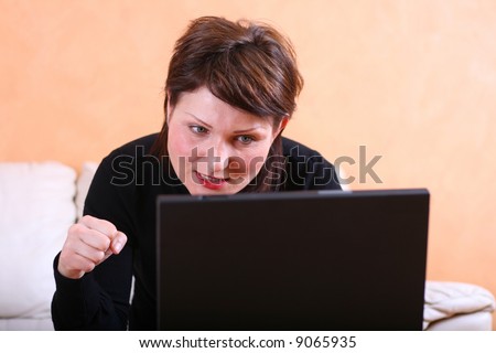 Young lady with a computer problem (or angry at her chatting partner)
