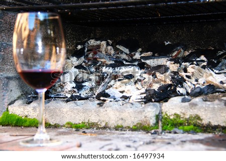 Wine glass next to an open fire (shallow DOF)