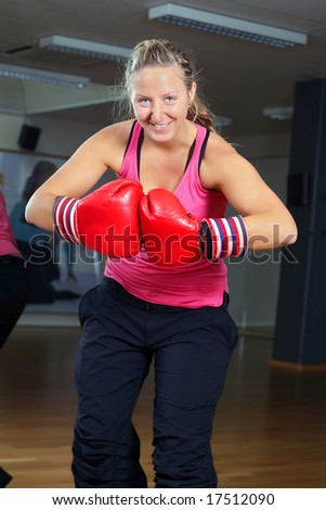 Sporty girl in boxing gloves