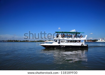 FORT KOCHI, INDIA - OCT 02 : A ferry transports people to main land Ernakulam on October 02, 2012 in Fort Kochi, India.Ferries are the fastest form of transport between Fort Cochin and the mainland