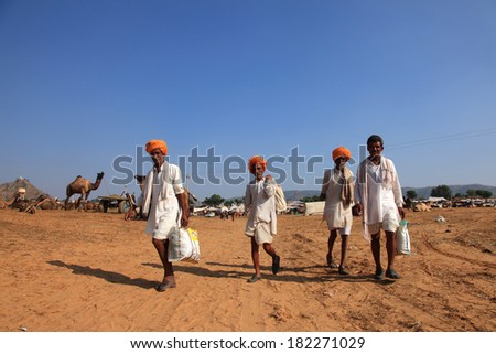 PUSHKAR, INDIA - NOV 19: Unidentified farmers come to participate in the Pushkar Fair on November 19, 2010. Pushkar fair is held annually in Rajasthan to trade camels, horses and cattle.