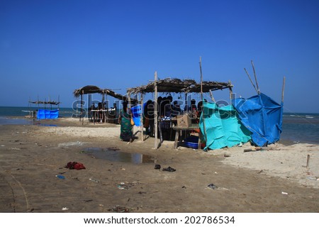 DHANUSHKODI, INDIA - OCT 05: Locals operate temporary tea shops by the seaside on October 05, 2013 in Dhanushkodi, Tamil Nadu, India. Dhanushkodi suffered major damage in a devastating cyclone in 1964