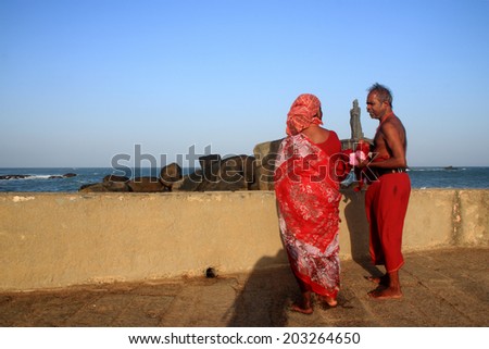KANYAKUMARI, INDIA - OCT 04:An unidentified couple looks at the Thiruvulluvar statue on October 04, 2013 in Kanyakumari,Tamil Nadu, India. Kanyakumari is the southern most tip popular for pilgrimage.
