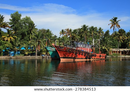 KOLLAM, INDIA - APR 17 : Fishing boats are docked in the Ashtamudi lake on April 17, 2015 in Kollam,Kerala, India. Astamudi is the second largest estuarine system in Kerala with large fish resources.