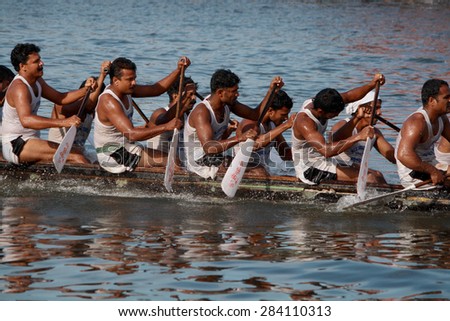 ALLEPPEY, INDIA - AUG 14 : A snake boat team participates in Nehru Trophy Boat race on August 14, 2010 in Alleppey, India.Nehru Trophy Boat race is very popular and competitive race event of Kerala.