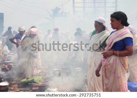 ATTUKAL, INDIA - MAR 7: Unidentified devotees take part in the \'Pongala\' ritual on March 7, 2012 in Attukal,Kerala,India.The event is in Guinness records as the largest gathering of women in the world