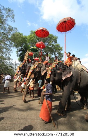 THRISSUR, INDIA - MAY 12 : Decorated elephants stand in line for procession at Elephant Festival on May 12, 201 in Thrissur, India. Thrissur Pooram is the most popular elephant festival in India.