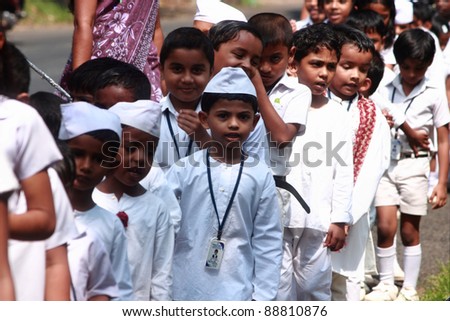 ALLEPPEY, INDIA - NOV 14 : Unidentified school children move in a line to celebrate children\'s day on Nov 14, 2011 in Alleppey, India.