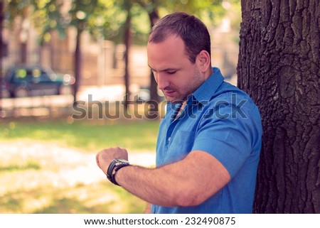 Man looking at his watch