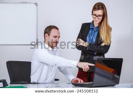 Man and woman working with computer