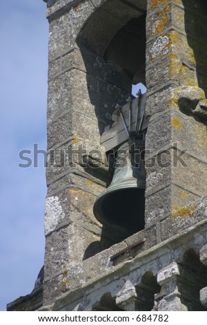 Old church bell in a clock tower of a very old French church