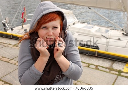Female getting cold in marina