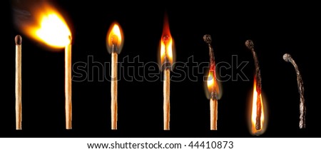 Matches, different stages of burning on a black background.
