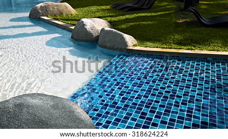 Pool with blue ceramic tiles and water ripple effect