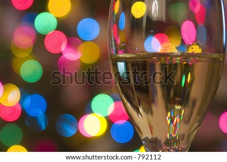 Close up on a Wine Glass with the lights on the background
