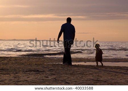 Father and Son on the Beach - Silhouette Shot