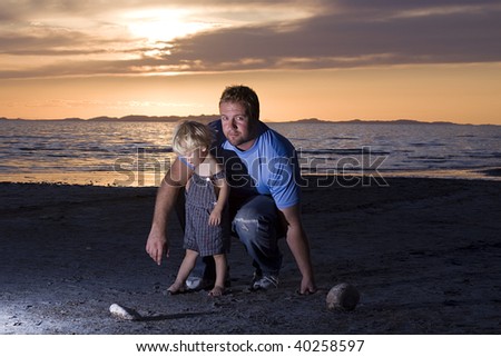 Father and Son on the Beach posing for the Camera