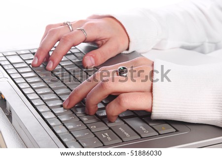 Close up on a Girl\'s Hand Typing on the Laptop