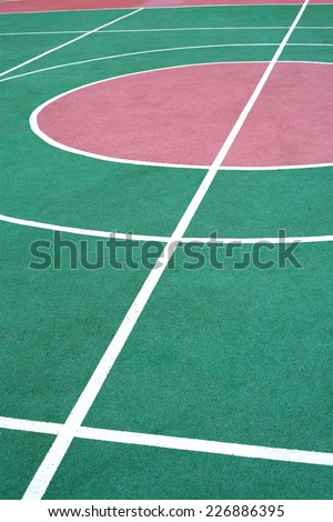 Outdoor sport ground surface with color parts and white marking line. Vertical view
