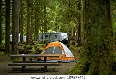 The Campground - Small Orange Tent And Travel Trailer In The Background ...