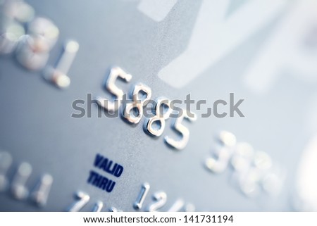 Credit Card Number Closeup. Banking and Transaction Technology. Credit Card in Macro Photography.