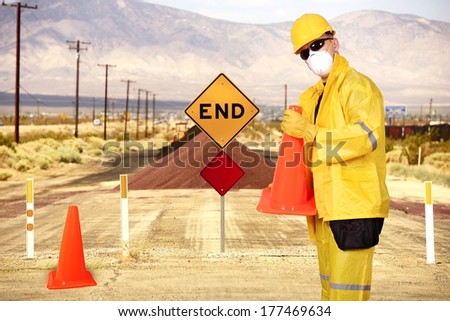 Road Construction with Contractor in Yellow Weather Suit. Road End.