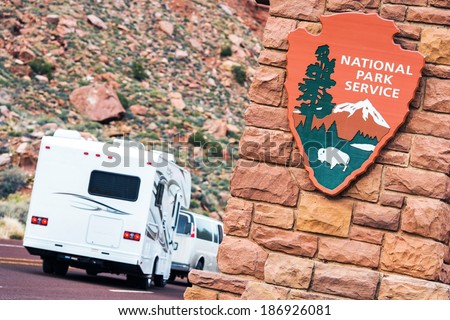 American National Parks RV Journey. National Park Service Shield. Zion National Park Entrance.