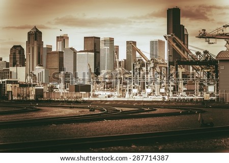 Vintage Port of Seattle. Vintage Brown Color Grading. Tracks and the Seattle Skyline. Seattle, Washington, United States.