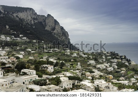 Capri by a sunny day on Bay of Naples.  Tourist attraction noted for its beautiful scenery and luxurious  houses.