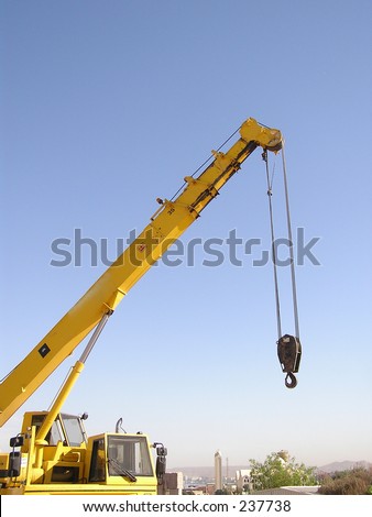 crane on the blue sky of Aswan, Egypt used to carry granite blocks for the International symposium