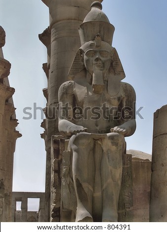pharaoh Ramses 11 statue, in front of columns  in Karnak temple, Egypt, Africa