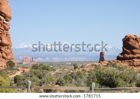 Scenic view of Arches National Park with snowy mountains in the back,  Utah, USA