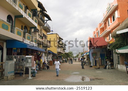Street scene with tourists and merchants showing display and stores on coasts of Playa del Carmen, Mexico