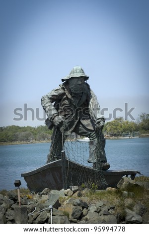 WOODLEY ISLAND, CALIFORNIA - MAY 9: The Fisherman, pictured on May 9, 2006 in Woodley Island, CA, is a memorial statue by artist Dick Crane which commemorates mariners who lost their lives at sea.