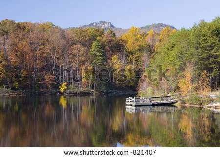 THE KINGS PINNACLE FROM LAKE IN FALL CROWDERS STATE PARK NORTH CAROLINA