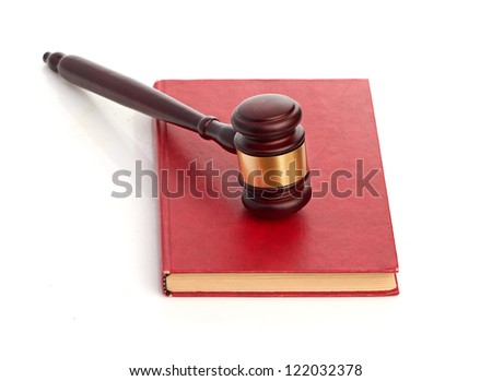 Judge's gavel on red legal book isolated