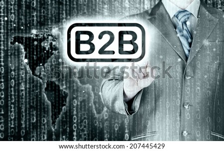 businessman pointing to word B2B, business-to-busines s, written in the foreground