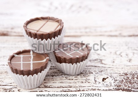 Dark chocolate on wooden background