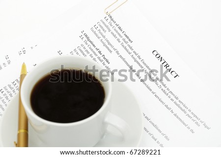 White cup of cappuccino on document background