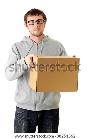 Young man carrying huge box