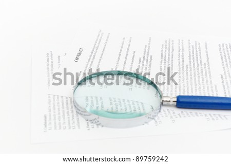 blue Magnifying Glass and document close up