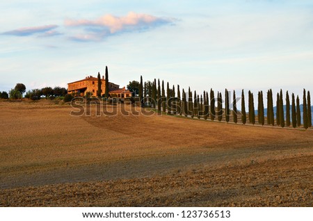 Idyllic rural Tuscan landscape with old farmhouse near Pienza at sunset, Vall d\'Orcia Italy, Europe