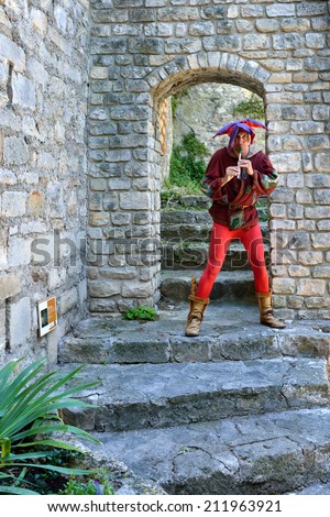PROVENCE, FRANCE - JUL 16, 2014: Unidentified musician perform in the street to entertain tourists in medieval village Vaison la Romaine.This is one of the popular for outdoor performances in Provence